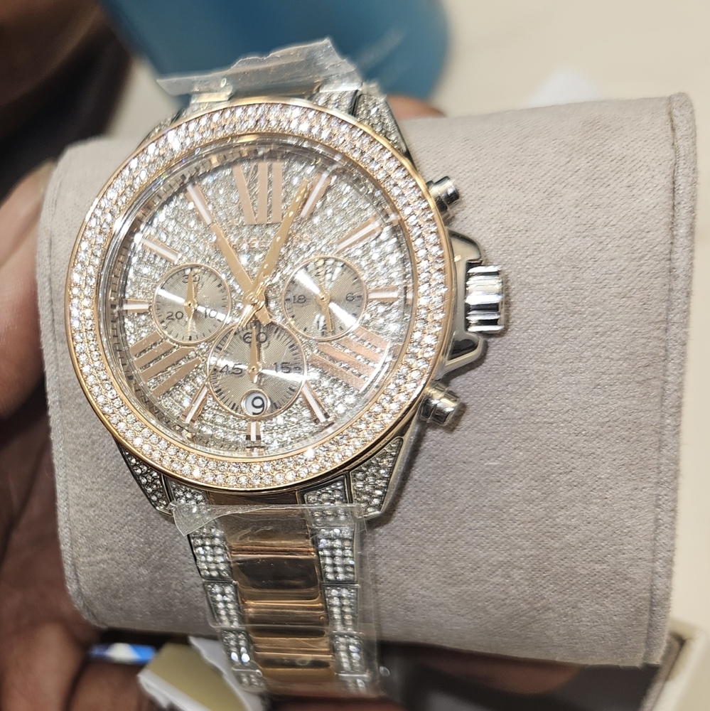 Brand New Michael Kors watch.   Rose gold and silver bezeled face and band. Rare